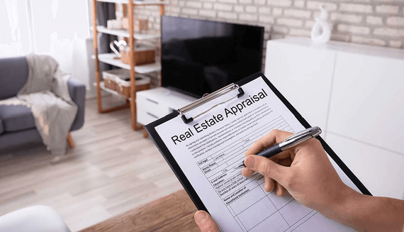 Real estate professional conducting a property appraisal for home valuation